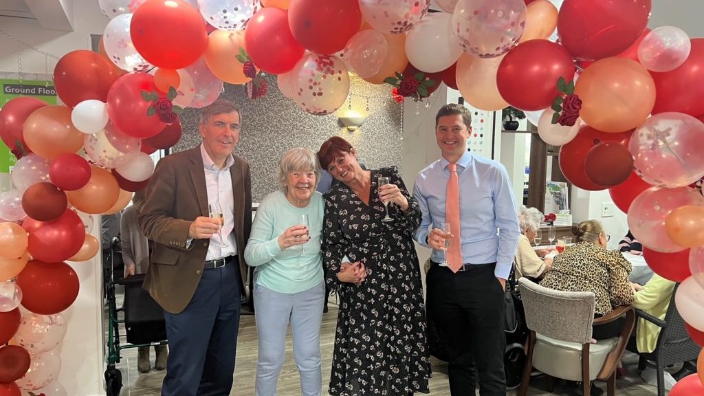 David Rutley MP for Macclesfield (left), celebrates with Belong Macclesfield, including general manager, Caroline Ray (2nd to right) and CEO, Martin Rix (right)