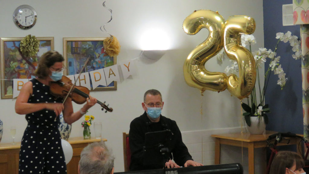 Violinist Jennifer Curiel and pianist Kevin Pritchard entertain the audience at Colten Care's Avon Cliff in Bournemouth during the home's 25th anniversary celebration.