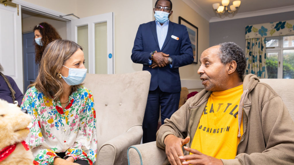 Minister Whately talks to a resident during her visit to Alexander Care Home