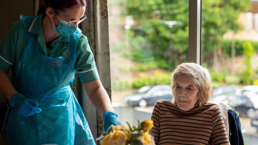 A carer and resident at Priesty Fields care home in Congleton