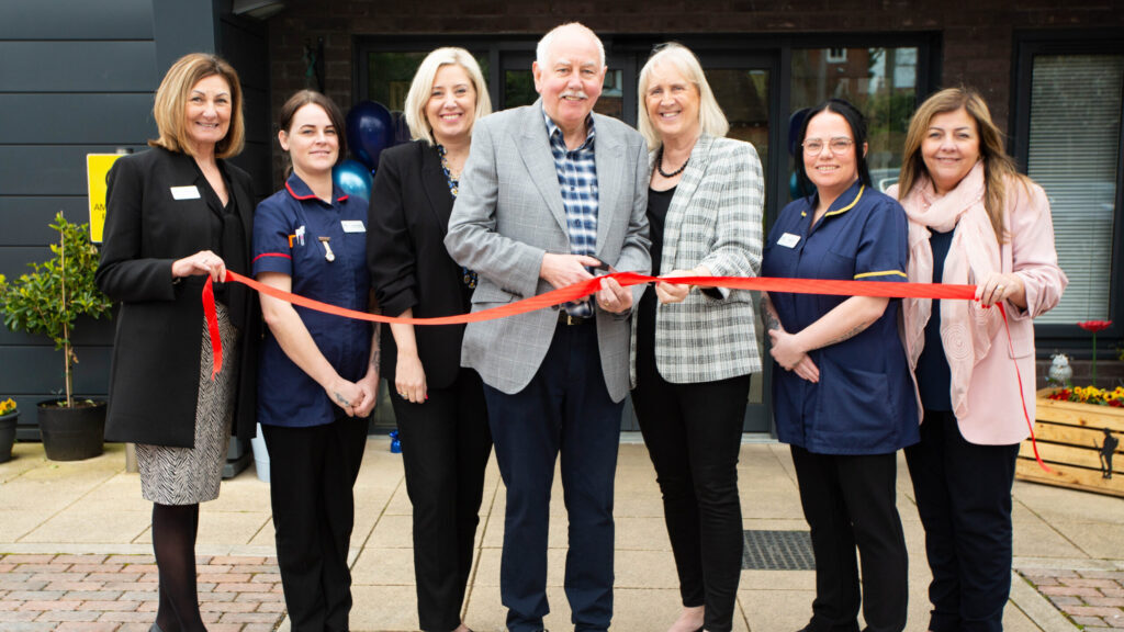 Home manager and Bramhall resident Helen Hartley along with her parents Chris and Dave Easley lead the ribbon cutting ceremony