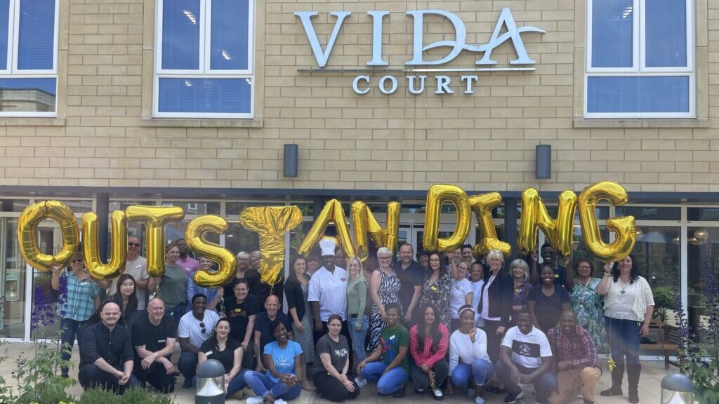 Vida Court staff celebrate their Outstanding rating