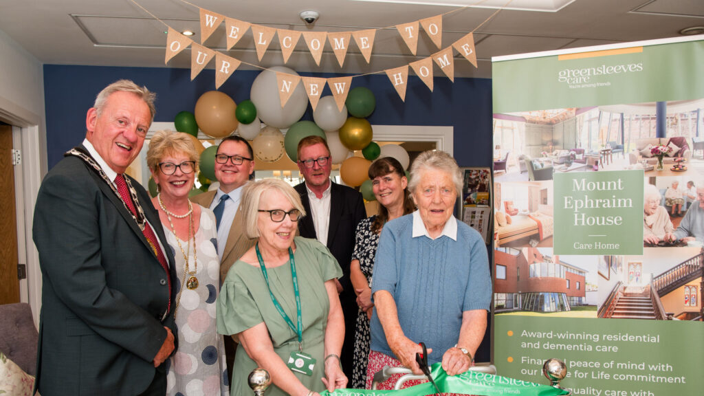 L-R Karen Cooper (home manager) and Christine Stone (resident). Back L-R Councillor Hugh Patterson (Mayor), Sandra Patterson (Mayoress), Paul Newman (chief executive, Greensleeves Care), Chris Doherty (chief financial officer, Greensleeves) and Mandy Whittingham (divisional director (South), Greensleeves)