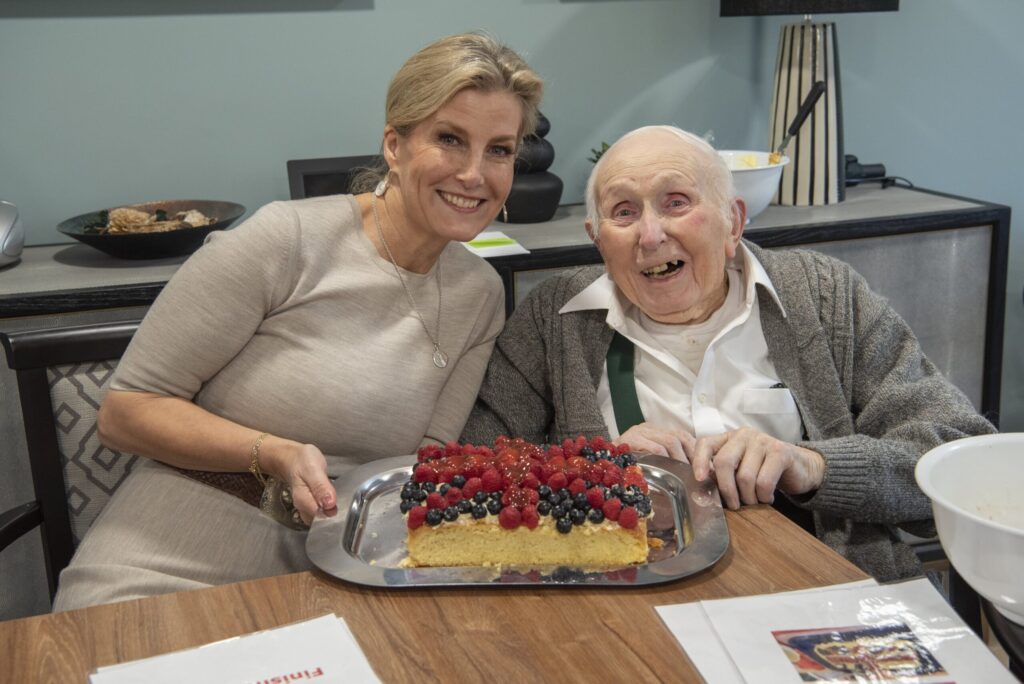 The Duchess took part in decorating a cake with residents to celebrate the 75th birthday of HM The King