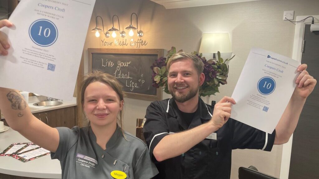 Coopers Croft team members Megan Boyle and Samuel Smith celebrate top marks from carehome.co.uk