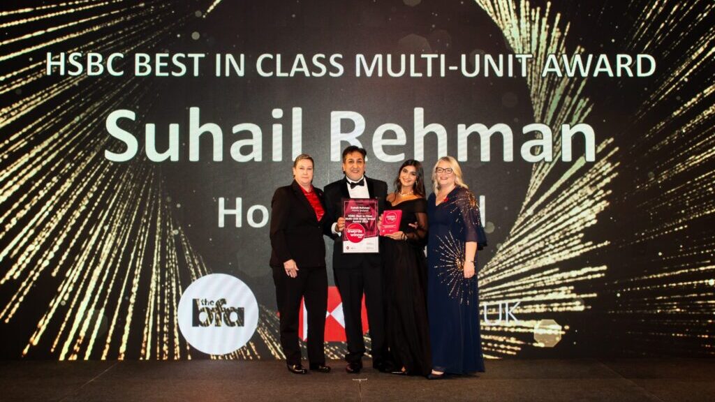 Suhail Rehman accepts his award at the 2023 BFA HSBC British Franchise Awards
