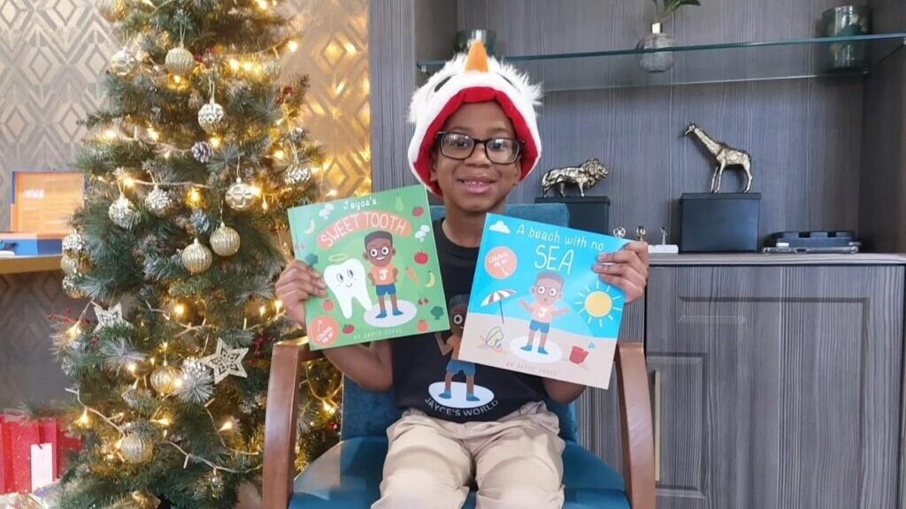 Record breaking five-year-old author, Jayce Joyce shows off his published books