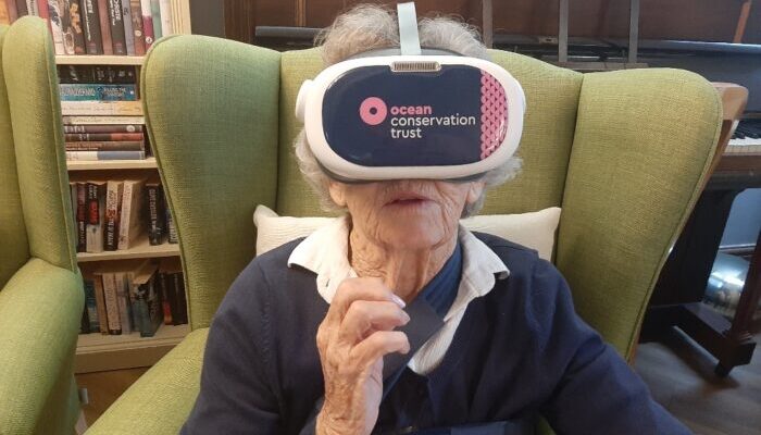 A Vale View Heights resident enjoys a VR experience provided by Plymouth Aquarium