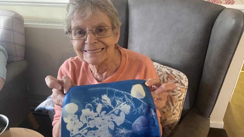 A resident with her Cyanotype print creation. Picture credit: Jack Lowe.