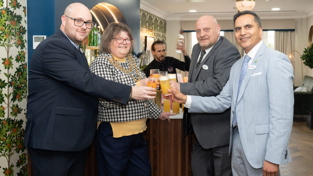 Sip, sip, hooray! The Mayor Councillor Candy Vaughan, managing director Aneurin Brown (left) general manager Ian Cole and founder Avnish Goyal celebrate Willingdon Park Manor opening with a cocktail